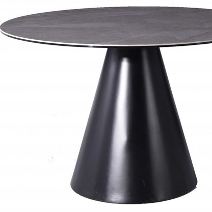 Sloane 47-inch round dining table with a grey stone top on an iron pedestal base, additional view