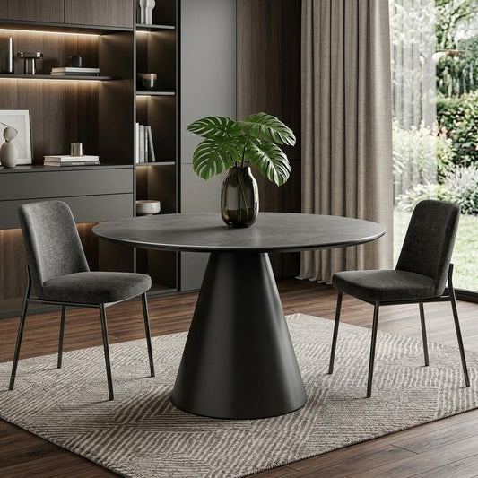 Sloane 47-inch round dining table with a grey stone top on an iron pedestal base