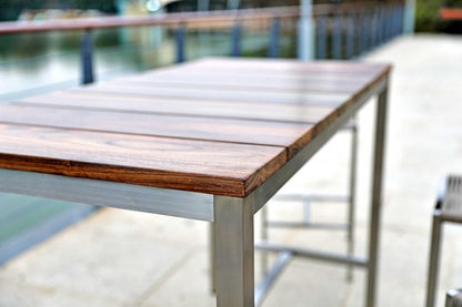 Ellis 55-inch dining table with a brown solid wood top on a silver stainless steel base, additional view