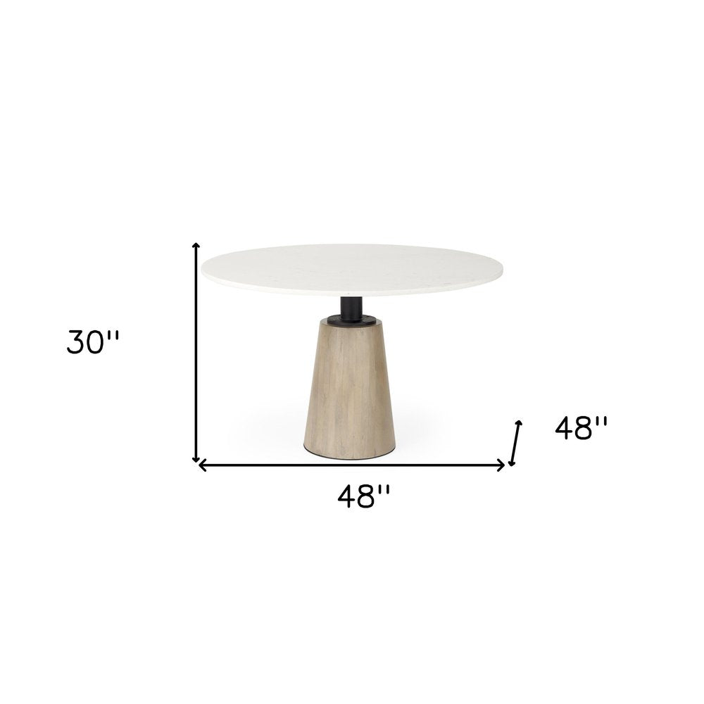 Marlow 48-inch round dining table with a white marble top on a tapered wood pedestal, additional view