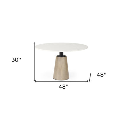 Marlow 48-inch round dining table with a white marble top on a tapered wood pedestal, additional view