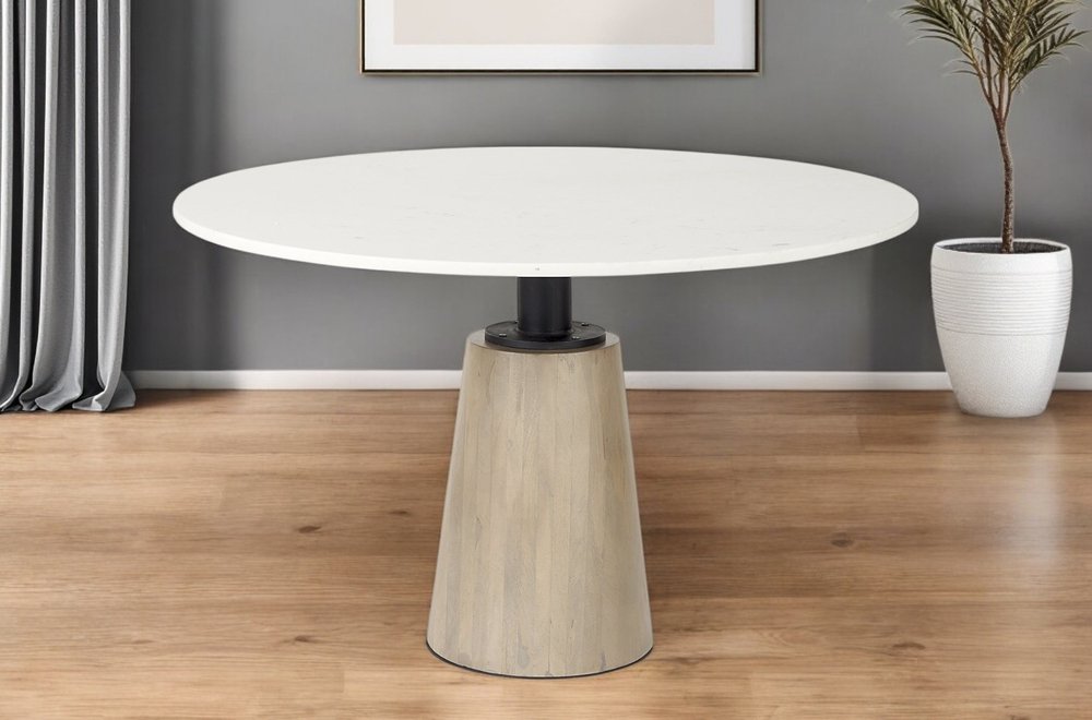 Marlow 48-inch round dining table with a white marble top on a tapered wood pedestal