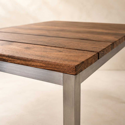 Ellis 55-inch dining table with a brown solid wood top on a silver stainless steel base