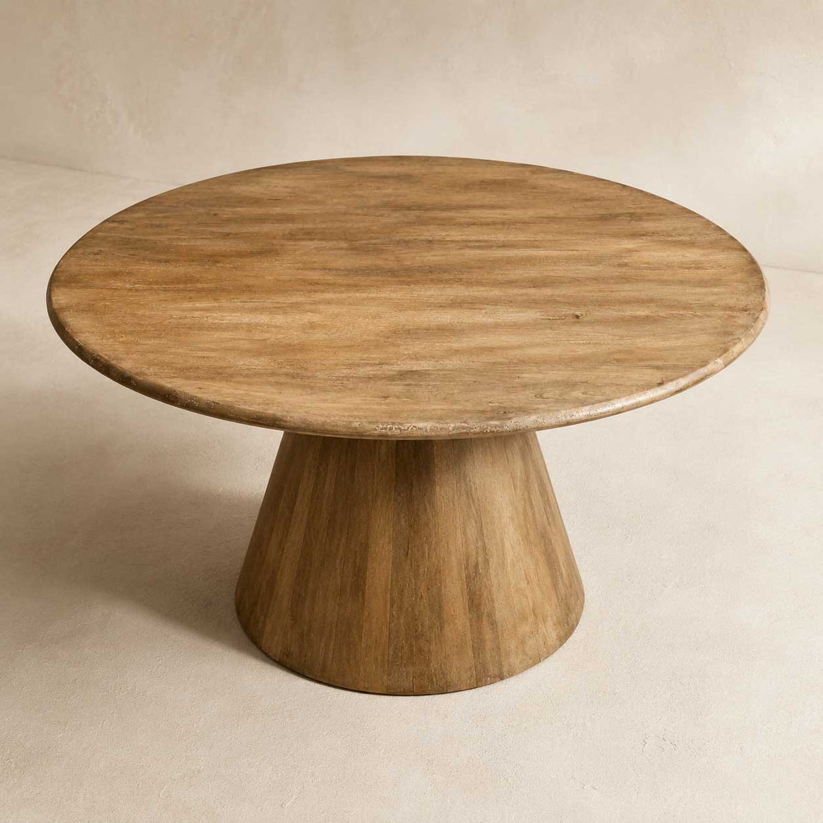 Rowan 60-inch round dining table in natural distressed solid wood on a pedestal base